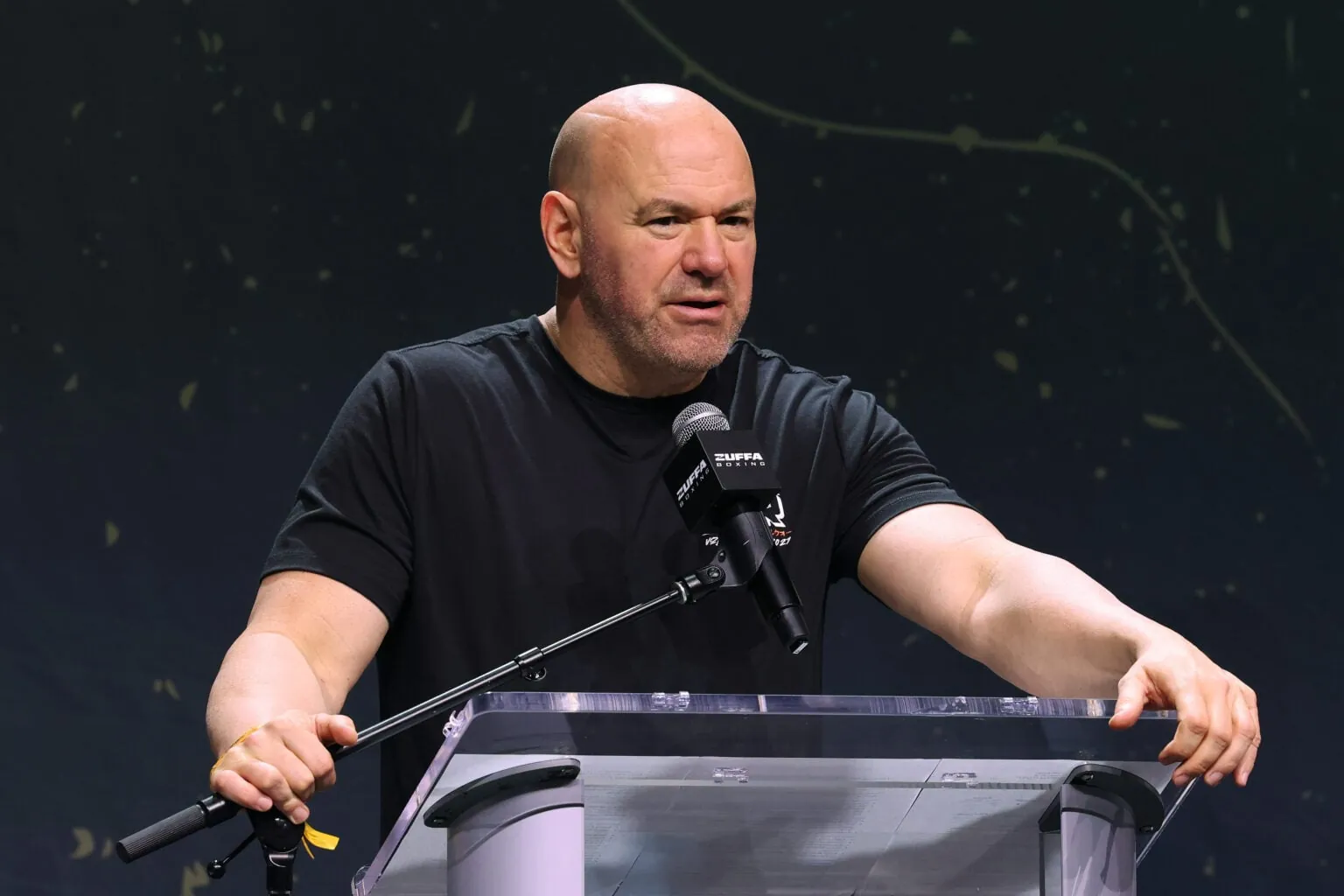 Dana White speaks on stage at a press conference at Fanatics Fest